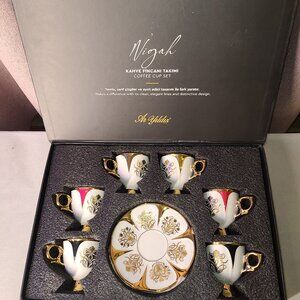 Formal or ceremonial set of Turkish coffee cups and saucers.